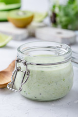 Healthy yoghurt drinks with fresh vegetables and fruits in glass jar