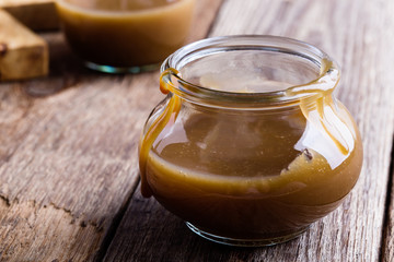 Homemade caramel sauce in  glass jar