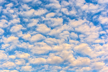 Clear sky and fluffy clouds