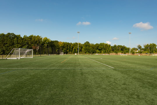 Soccer field background with a shallow depth of field on a beautiful summer day