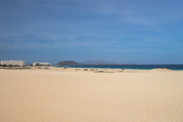 Fototapeta na wymiar Sand dunes on the seashore of the Islands on the Atlantic Ocean. Nobody, only steps
