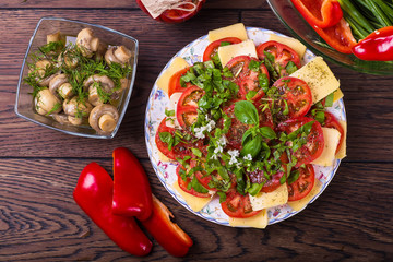 Vegetarian salad with cheese and tomatoes