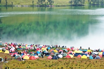 Ranukumbolo lake. Camping in the side of lake. Large group of tent in the lake