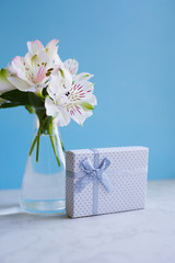 Beautiful tender bouquet of Alstroemeria with white gift box