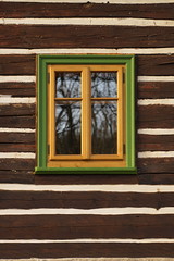 Wooden window on the wooden wall.