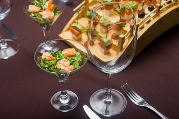 there are points and salad, a canape, panna cotta on a table at restaurant