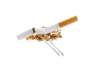 Cigarette with needles and tobacco on white background