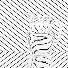 Glass jug on striped background. Black and white monochrome.