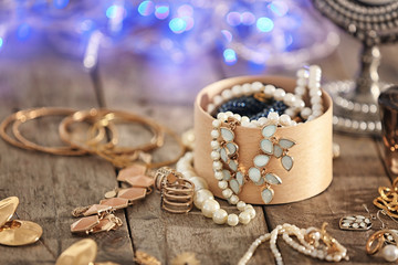 Jewelry and box on wooden table