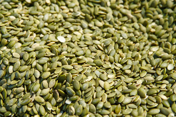 Background of pumpkin seeds, selective focus