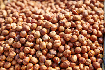 Hazelnut Background. Heap of peeled hazelnuts.