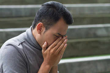 allergic sick asian man sneezing