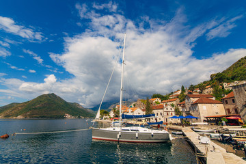 Fototapeta na wymiar Yachts near the old town of Perast in Montenegro