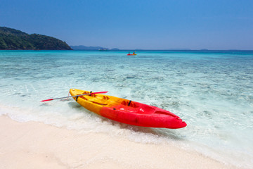Fototapeta na wymiar Colorful kayaks on tropical island beach, Thailand