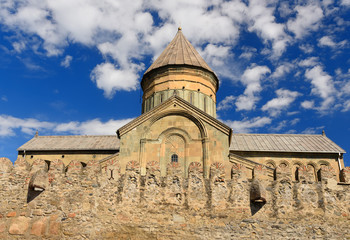 Fototapeta na wymiar Svetitskhoveli Cathedral is surrounded by defensive wall. Mtskheta, Georgia