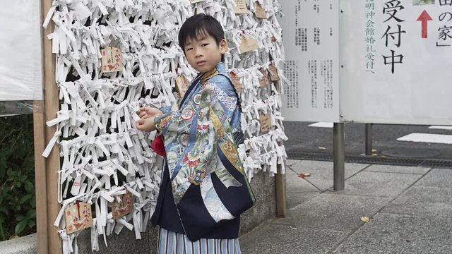 A five year old boy dressed up in a Hakama to celebrate the Shichi-Go-San Festival