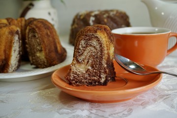 Marble cake and chocolate cake and hot coffee - soft focus
