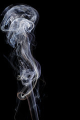 Abstract white blue smoke from aromatic sticks.
