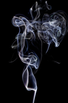 Abstract white blue smoke from aromatic sticks.