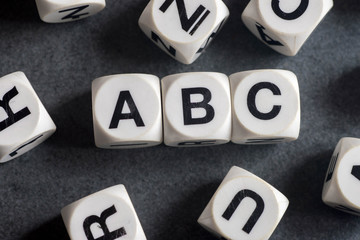 word abc on toy cubes