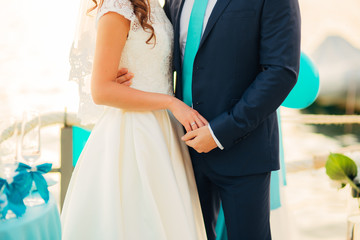 Fototapeta na wymiar Bride and groom holding hands. Wedding in Montenegro