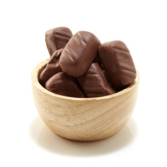 Chocolate candy in wooden bowl