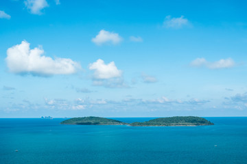 Fototapeta na wymiar Seascape and small island with blue sky