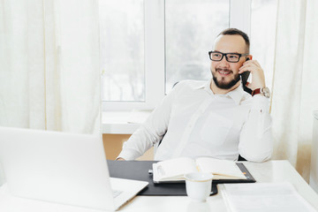 Portrait of a business man talking on a mobile phone