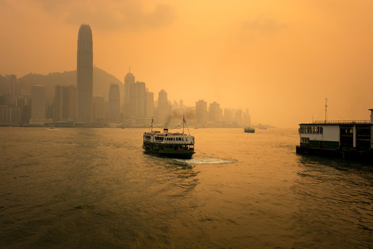 Hong Kong City skyline, ferry, and pier.