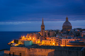 Fototapeta na wymiar Skyline of Valletta in the morning with Basilica and St. Paul's Anglican Cathedral