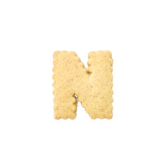 Closeup brown biscuit in N english alphabet isolated on white background with clipping path