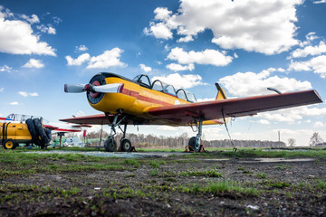 Obraz na płótnie Canvas Small sports aircraft at the ground airfield