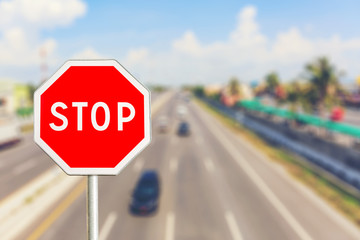 Stop sign by the Highway road
