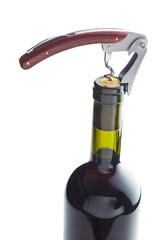 Bottle of wine with corkscrew.