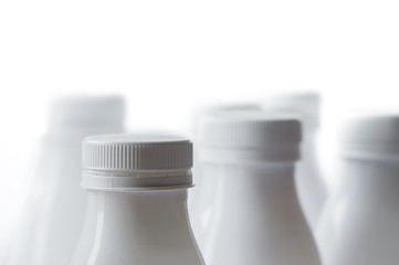 Group of white plastic milk or yogurt bottle on white background