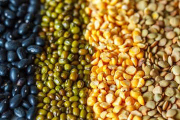 Cereals background: chickpeas, peas, lentils, black beans