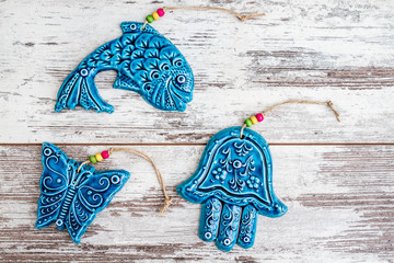 Turkish Handmade  Symbolic Ceramic Figurines on White Wooden Background