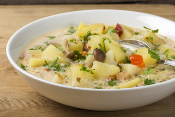 Mushrooms soup with sour cream and potatoes