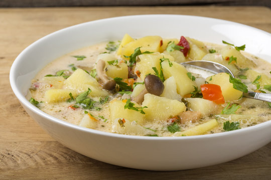 Mushrooms soup with sour cream and potatoes