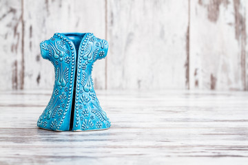 Turkish Handmade  Symbolic Ceramic Figurines on White Wooden Background
