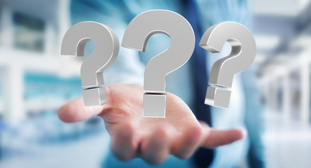 Businessman using 3D rendering question marks