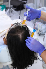 Naklejka premium Researcher performs blood centrifuging