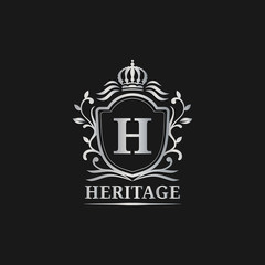 Vector monogram logo template. Luxury letter design. Graceful vintage character with crown illustration for hotel etc.