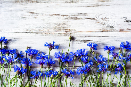 Blue Flowers, Summer Wildflowers On Wooden Background, Overhead