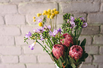  Craspedia, freesia and protea flowers. Flower market