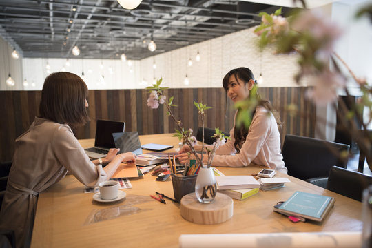Women are meeting in a stylish conference room