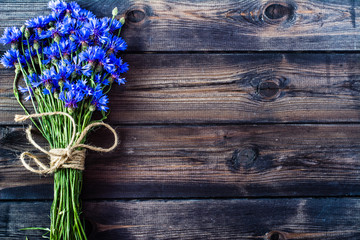 Summer flowers on wood, rustic style, copy space
