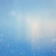 blue gradient background with snowflakes Winter bokeh