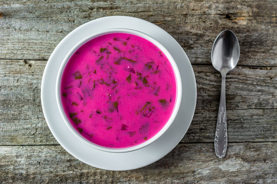 Cold soup with beet green leaves served with cream, summer cooking concept