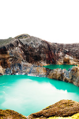 Obraz premium Kelimutu National Park in Indonesia. Colored lakes in Kelimutu volcano crater, Flores. Vertical photo, Unique place on Earth and nature miracle